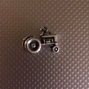A vintage James Avery charm of a tractor.